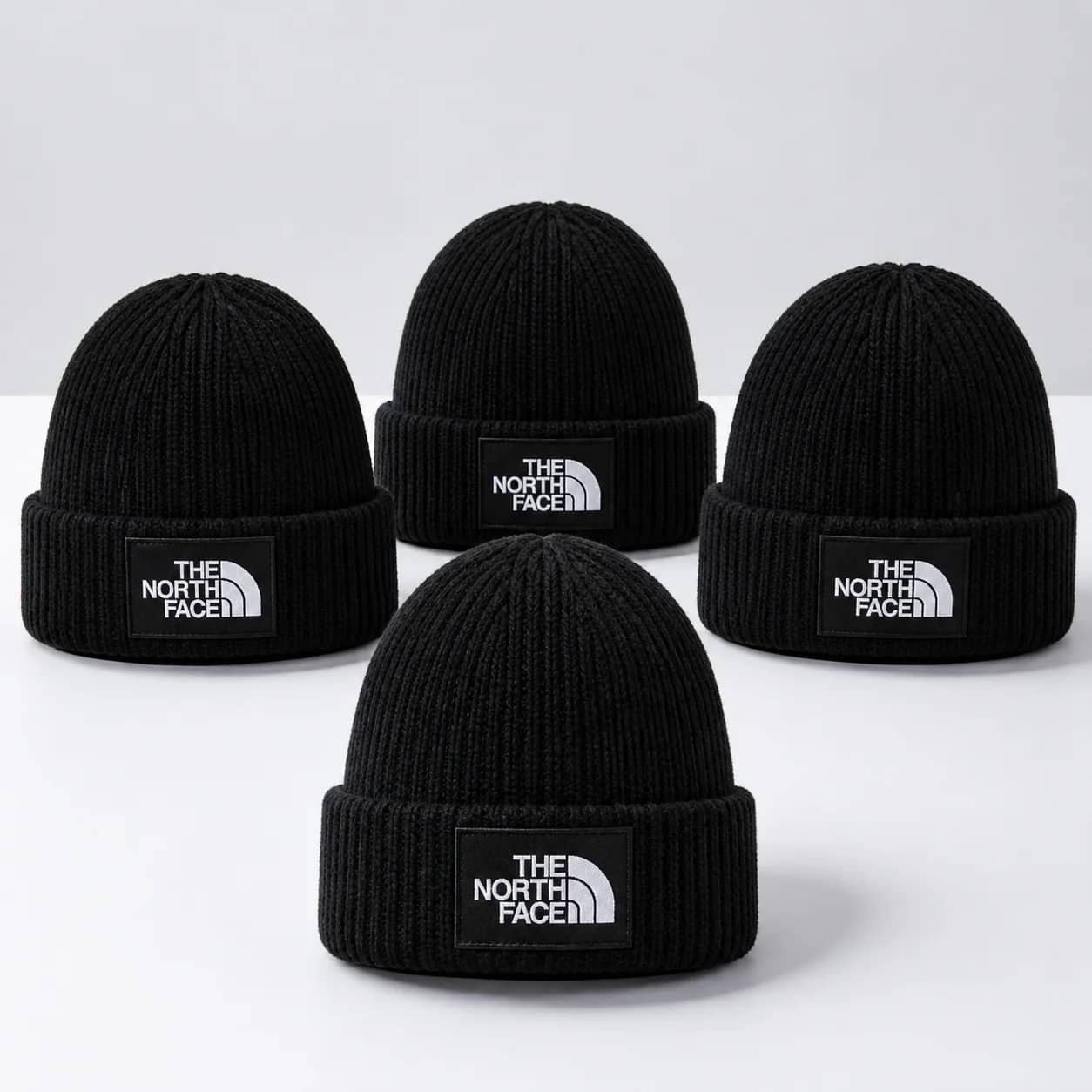 Cztery czarne czapki The North Face w zestawie 3+1 gratis